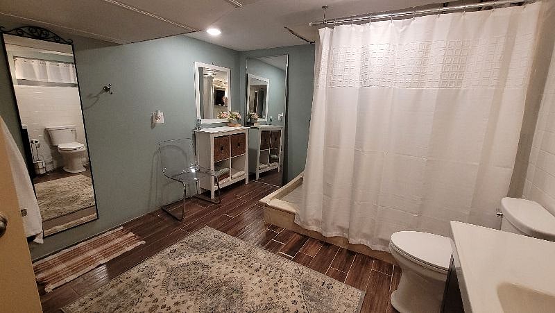 Storage areas, towels and bathmats provided.