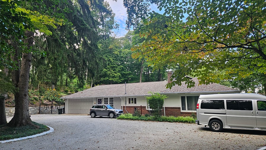 Ample parking, side view of home and main entrance area.