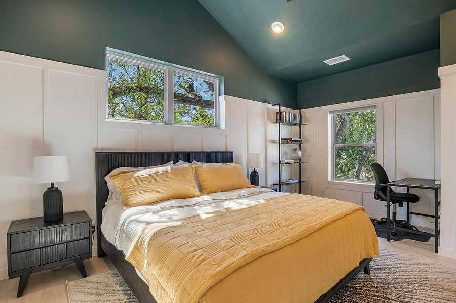 Master bedroom with traveling library and desk