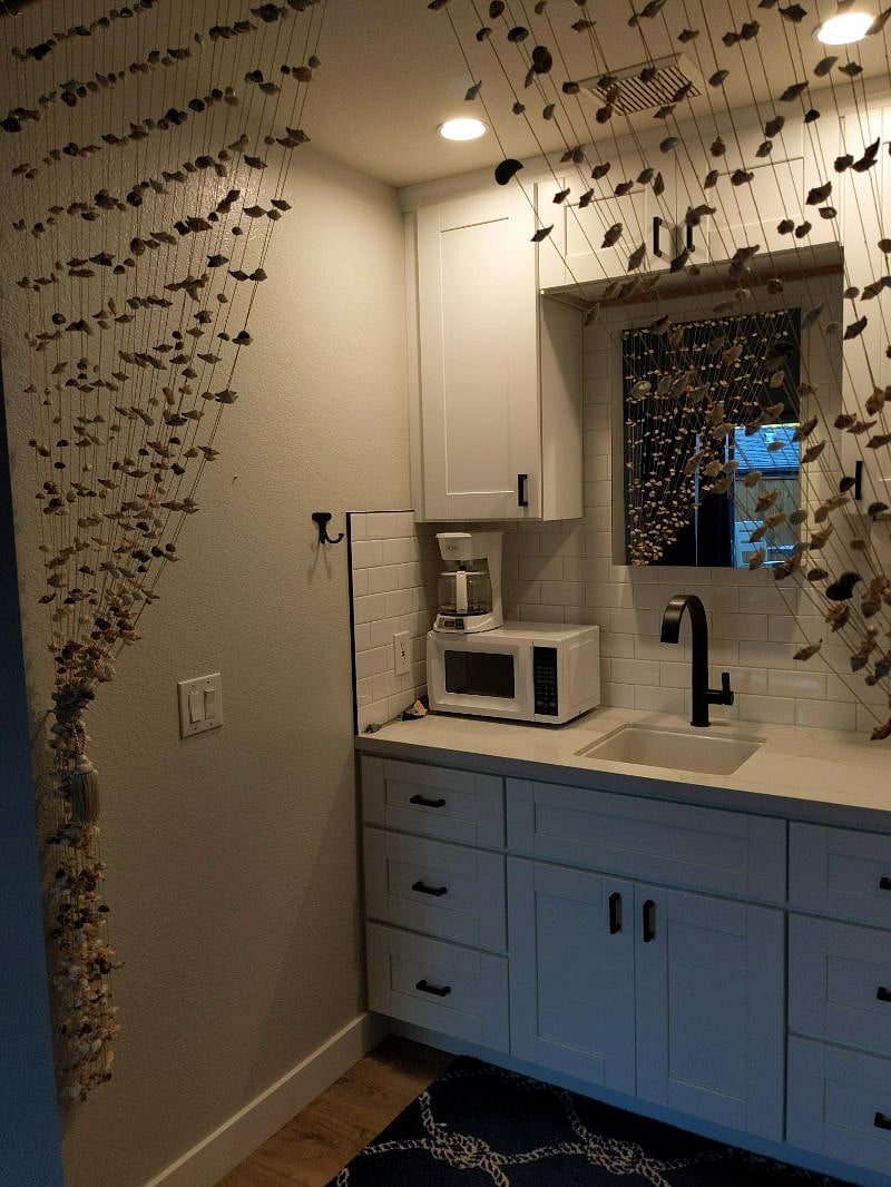 Microwave, huge sink, coffee maker, blender.