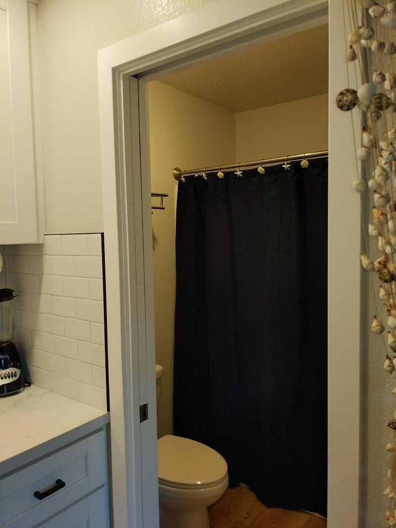 Full bathroom with bathtub.