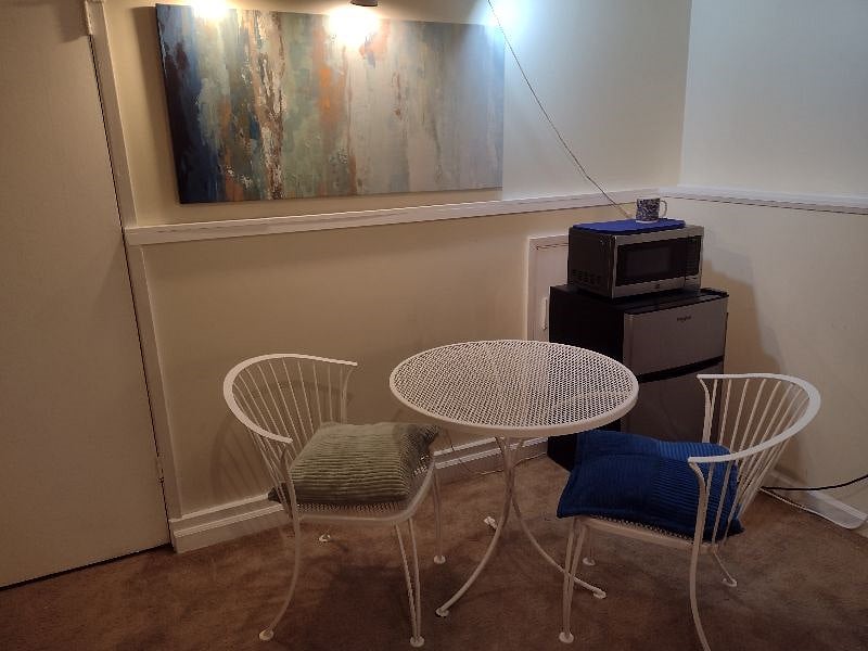 Your private cafe table and chairs, dorm fridge and microwave. Miniblinds at two windows.