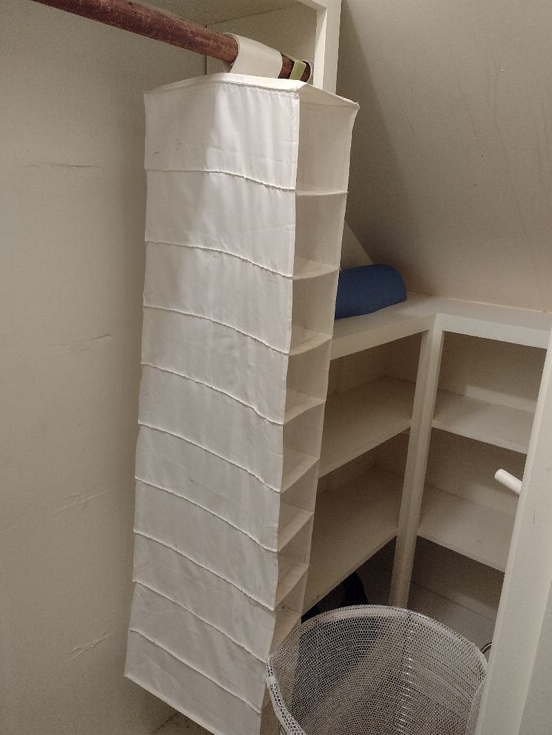 Cute built-in closet. Built in shelves, rod for hanging clothes. Shoe organizer.  