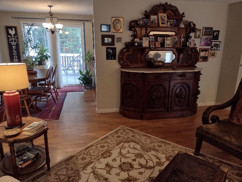 View from shared living room to dining area and deck.