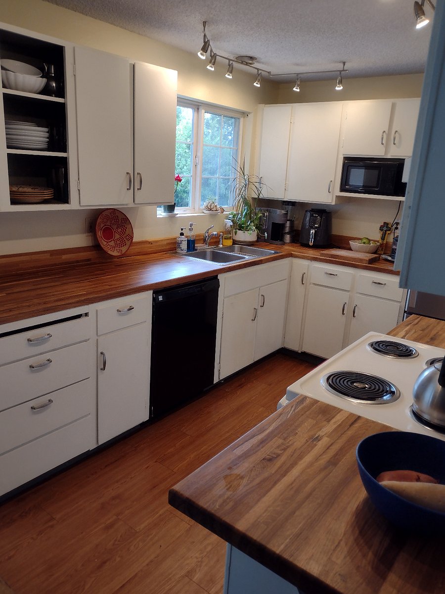 Shared kitchen, oak butcher block counters, micro, air fryer, blender, coffee maker, frig freezer, stove, stainless sink, dishes, storage