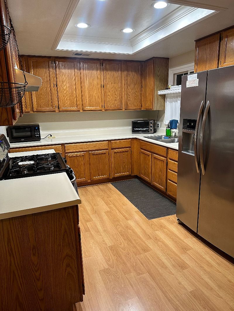 The kitchen is fully equipped with convenient appliances including an air fryer, juicer, crock pot, rice cooker, popcorn machine, and a classic fresh orange juice press. In the backyard, you'll find orange and lemon trees guests are welcome to enjoy fresh fruit straight from the garden.