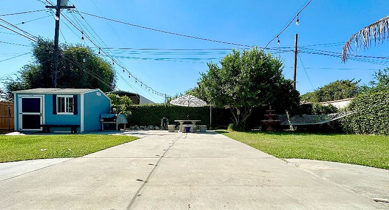 Our backyard is your personal oasis, complete with a cozy hammock, perfect for lazy afternoons.