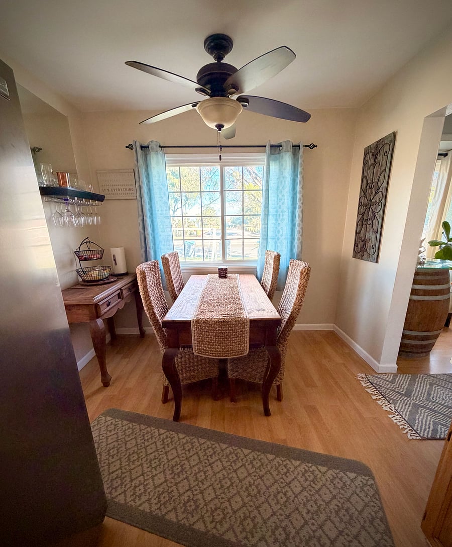 Our home features a cozy dining area with a lovely view of the front yard, as well as an outdoor swingperfect spots to enjoy your morning coffee or catch up on emails in a relaxed setting.