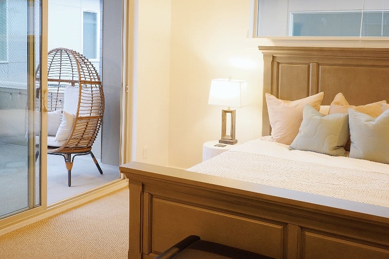 Relax in the master bedroom with a king-size bed and direct access to the patio lounge area, perfect for unwinding during your stay.