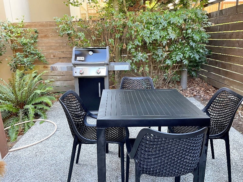 Explore a cozy patio, a great spot for outdoor dining and barbecues. Enjoy a meal or simply soak up the fresh air in this relaxing outdoor space.