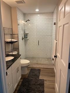Bathroom 1 sink, toilet and subway tile shower