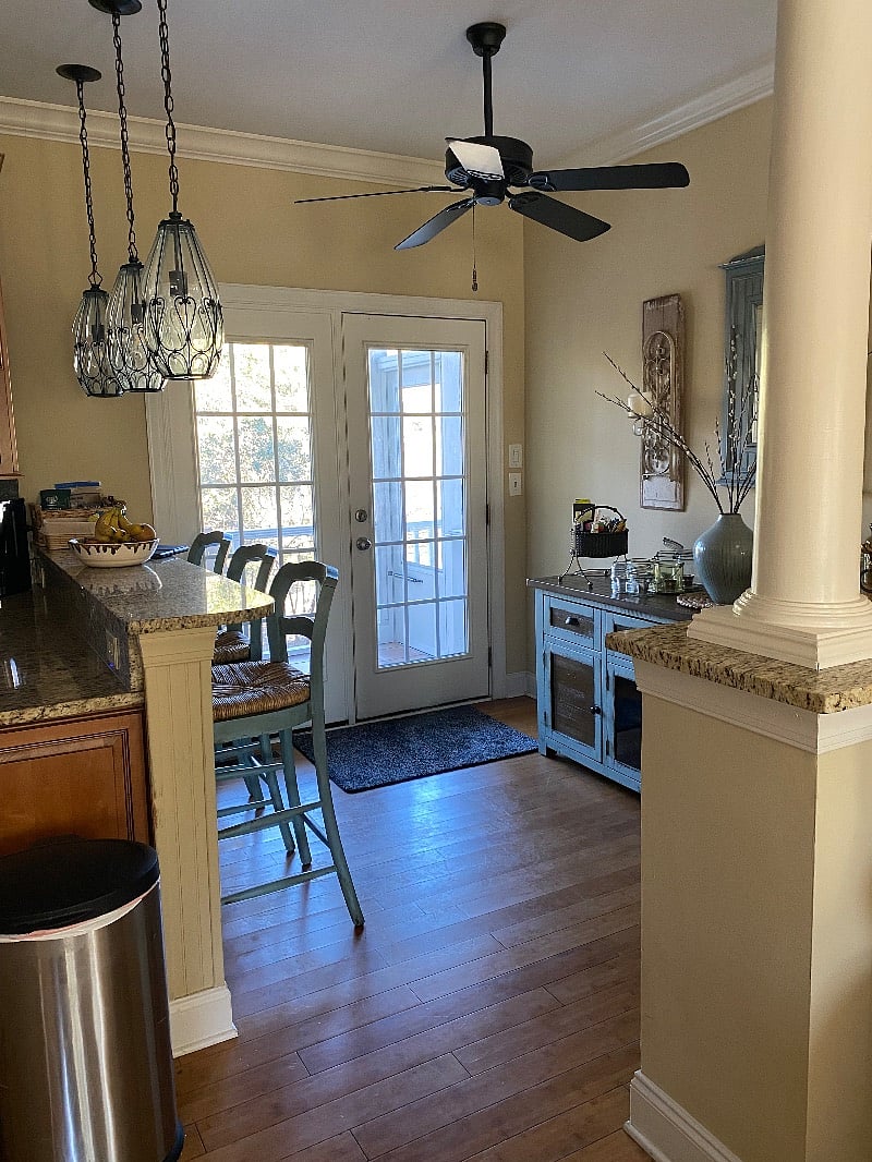 Doors to screened porch and stairs to pool and backyard