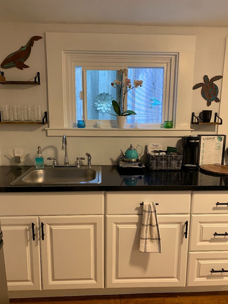 Kitchenette, sink, microwave, refrigerator, hot plate, coffee maker, toaster oven, stocked with kitchen ware