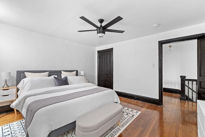 King Bedroom - view from corner by window with AC unit showing closet and door into hallway