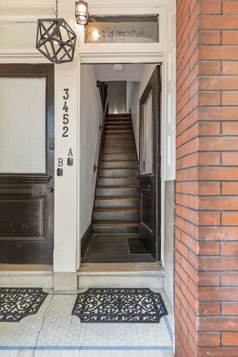 Entrance to unit 52A showing stairs to the top floor of the building.