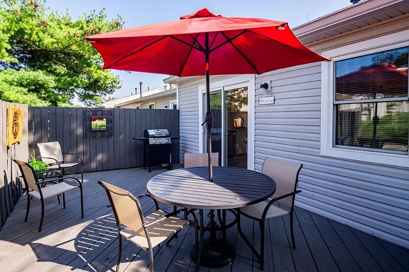 Large private rear deck with BBQ grill & table & chairs.