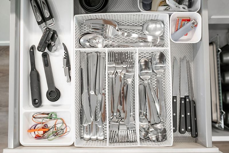 Silver ware drawer with measuring spoons/cups, vegi peeler, wine opener, chip clips, steak knives, etc.
