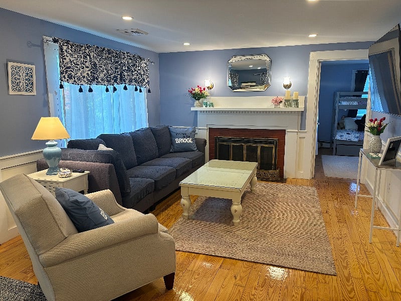 Spacious and comfortable living room with large Smart TV.