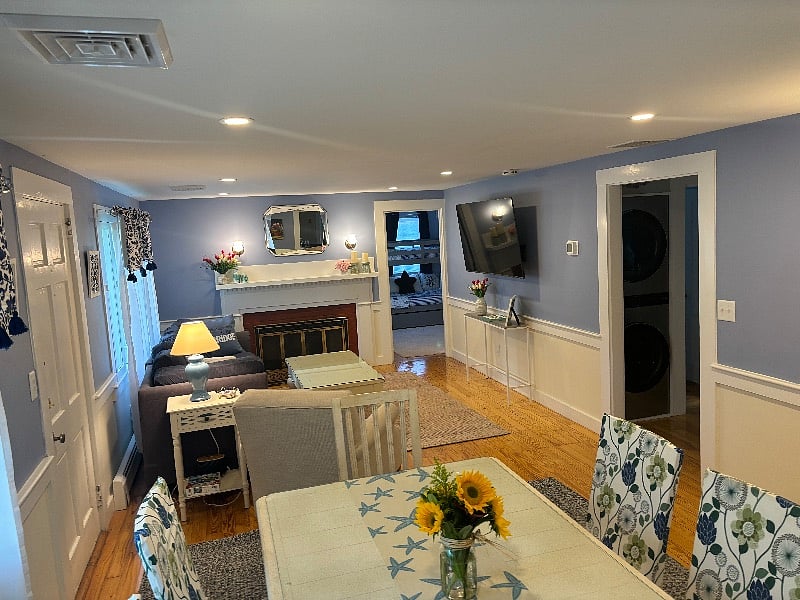 The open floor plan allows a free flow of space between the living room and dining room, with comfortable seating and common area luxuries.