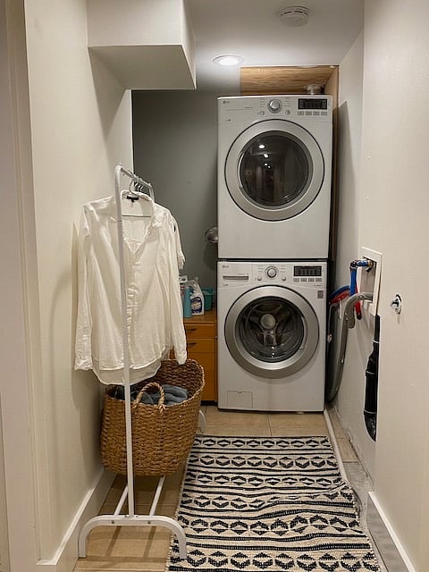 As you enter the basement apartment, on the right is your own stack washer and dryer with drying rack to use as needed.