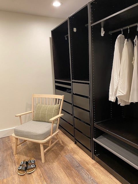 Another view of changing room/closet with chair for sitting as needed