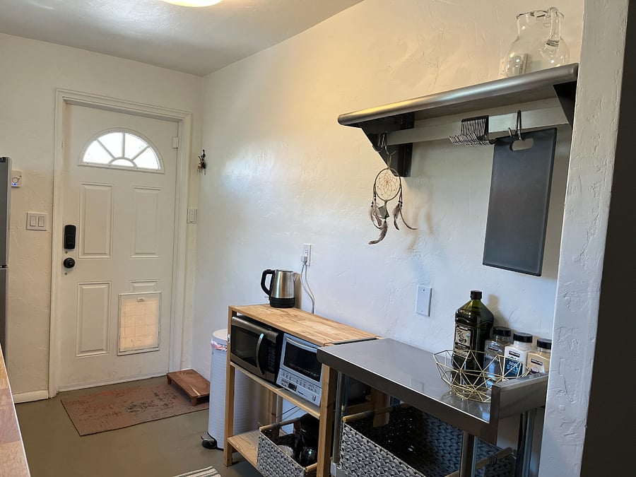 Kitchenette includes plenty of counter space, microwave, tea kettle, induction stove and toaster oven