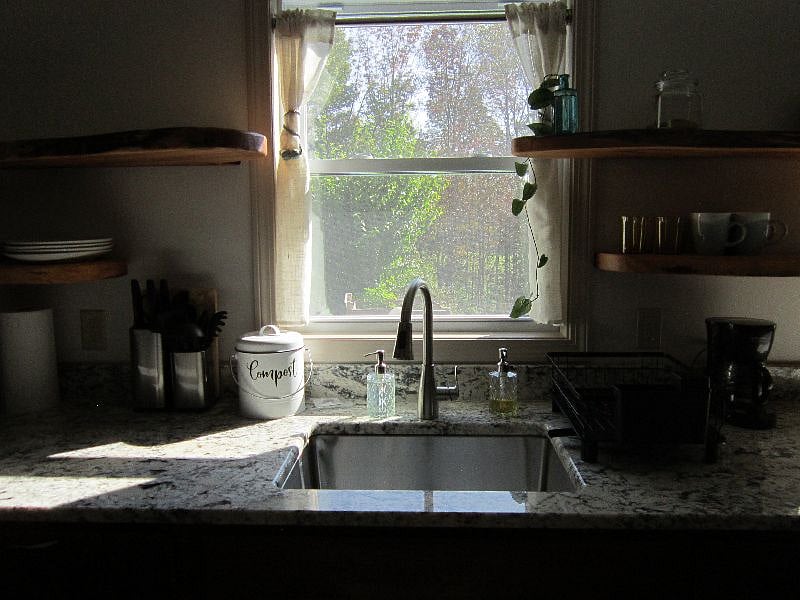 a lovely kitchen sink with a gorgeous east facing view