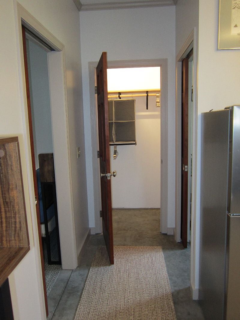 good size closet between bed and bath
