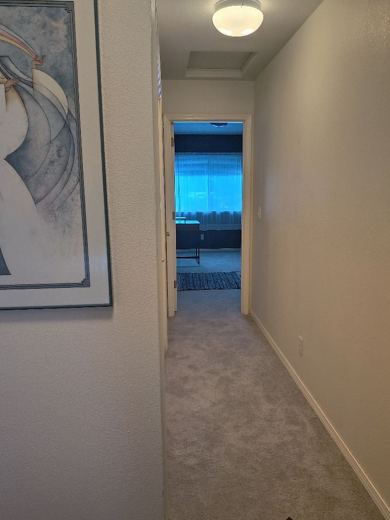 Upstairs hallway from top of stairs. 2nd bedroom ahead, master to the right