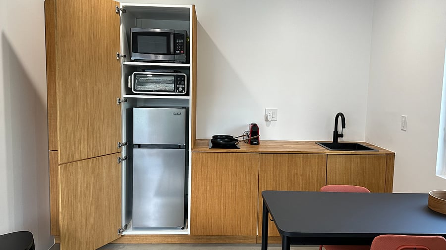 Appliances are hidden behind this cabinet out of view: refrigerator, air fryer/toaster oven & microwave
