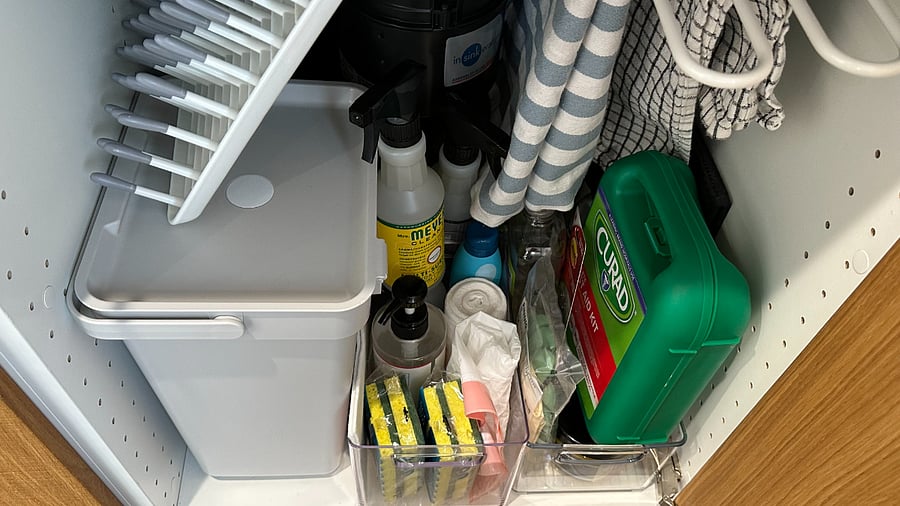 Cleaning supplies, dish rack, first aid kit, fire extinguisher. Bigger cleaning items, such as the vacuum, Swiffer, etc. are in the shed right next to the unit.