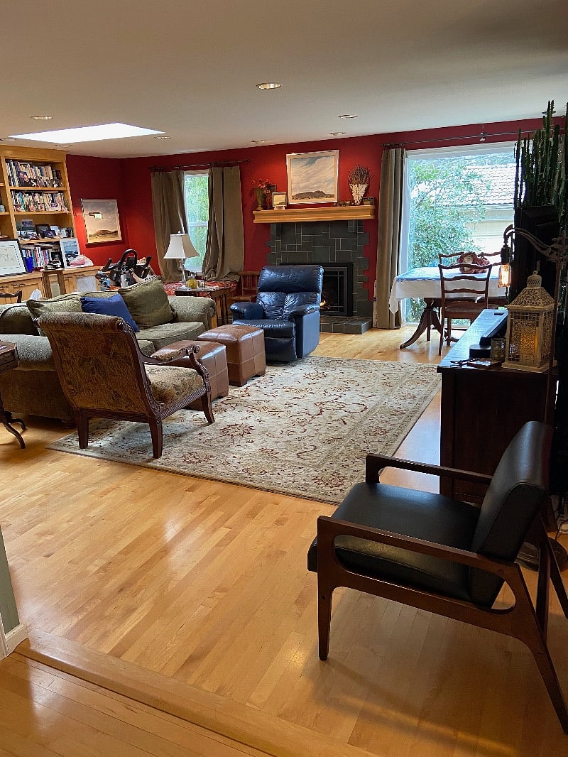 Den room with floor to ceiling windows, skylights, gas fireplace and smart TV. Extra dining room table here too. Lots of cozy places to sit and relax in this house. There is a gas fireplace here as well.