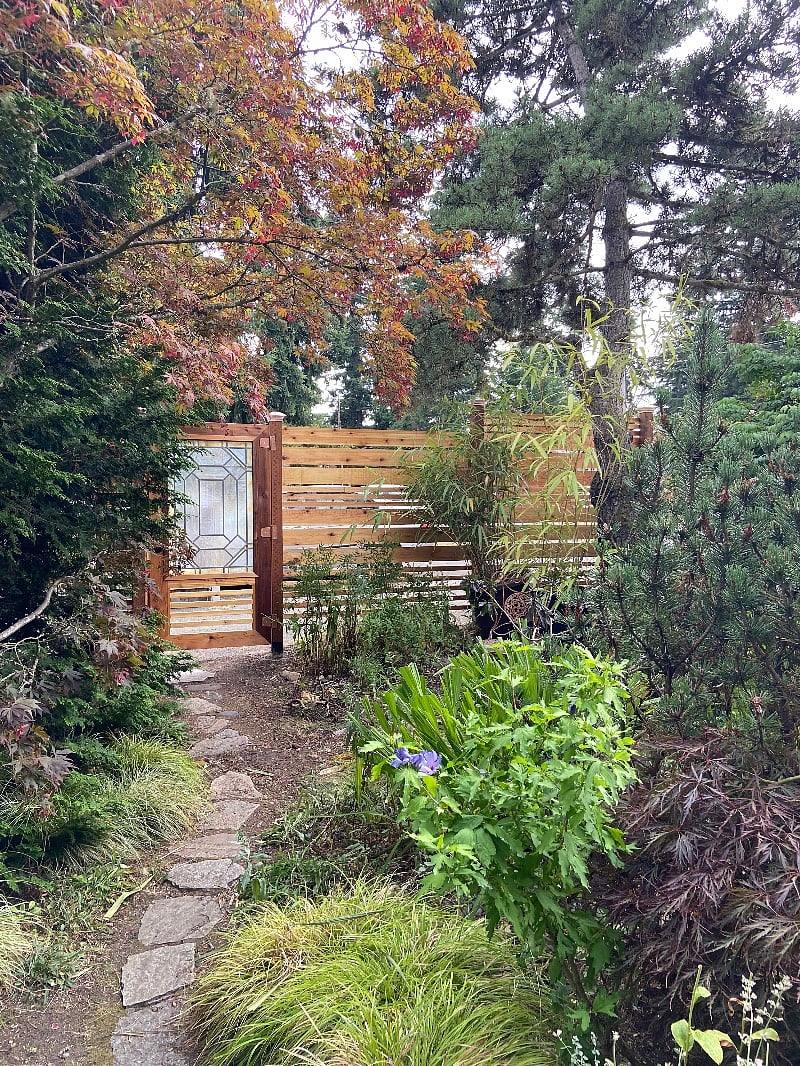 Front yard privacy fence along the driveway.