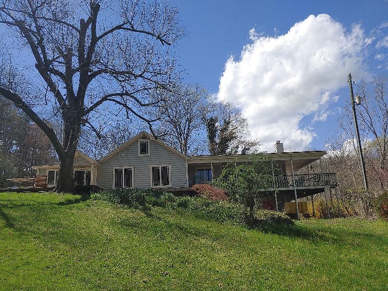 Left side is the two bedroom unit (original house). Right side is the addition with two one-bedroom units (one on each level).  Available unit is on the bottom right side - has a private patio.