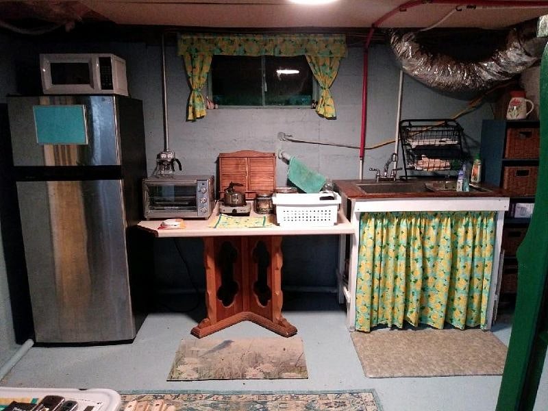 Unit 3:  Basement Kitchenette includes medium fridge & freezer (12 CU), full sink & drying rack, microwave, large toaster oven, hot plates, coffee machine, waffle maker, lots of gadgets, all cooking & eating utensils, plates, etc.  Does NOT include a dishwasher nor a stove/oven.  It is located about 5 steps from the studio unit in the basement laundry room (with window).