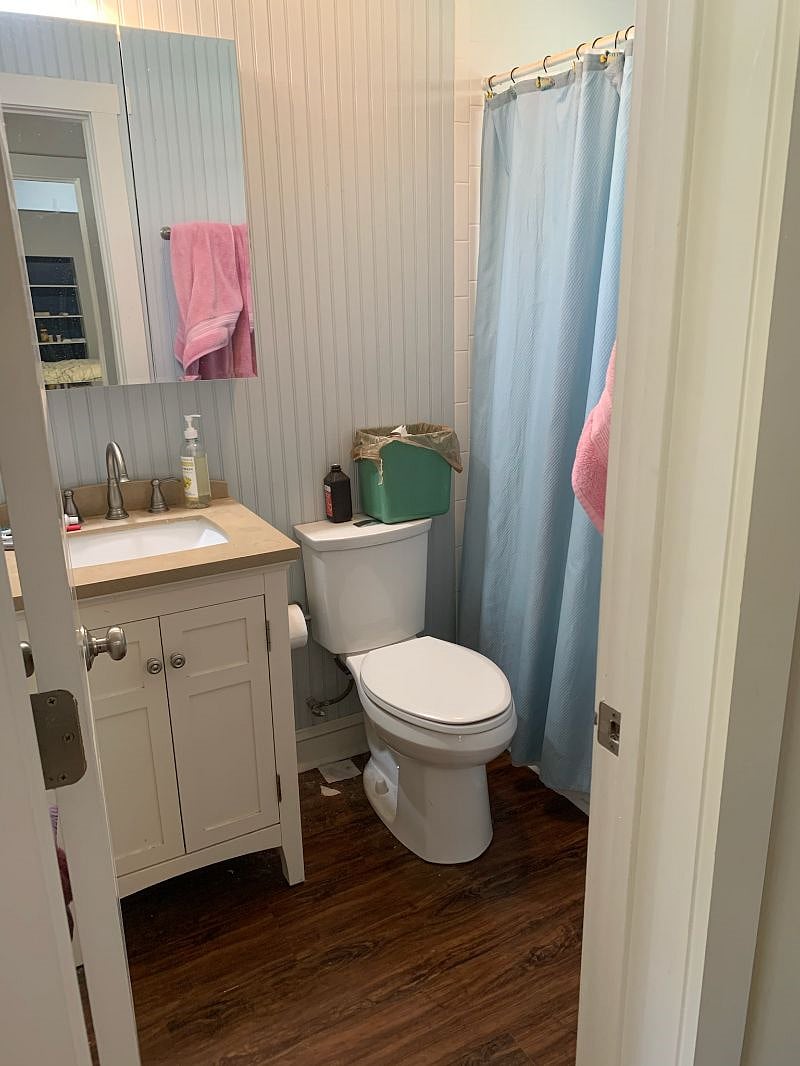 Unit 1 full bath (tub & shower) on main level across from bedroom #1 and living room.