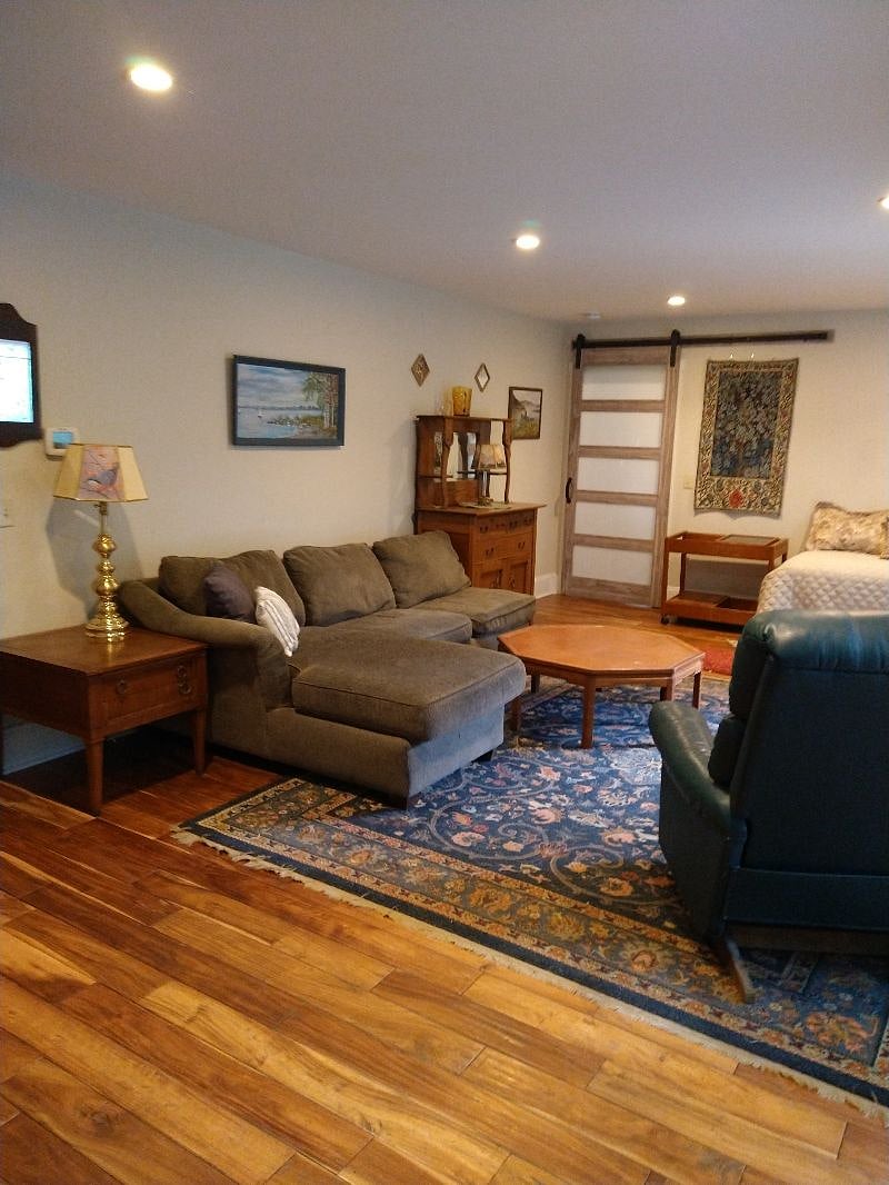 Living room for unit 1 (two bedroom unit).  It includes a second "couch" pictured on the right which is also two single beds (one slides under the other for storage, as pictured above).
