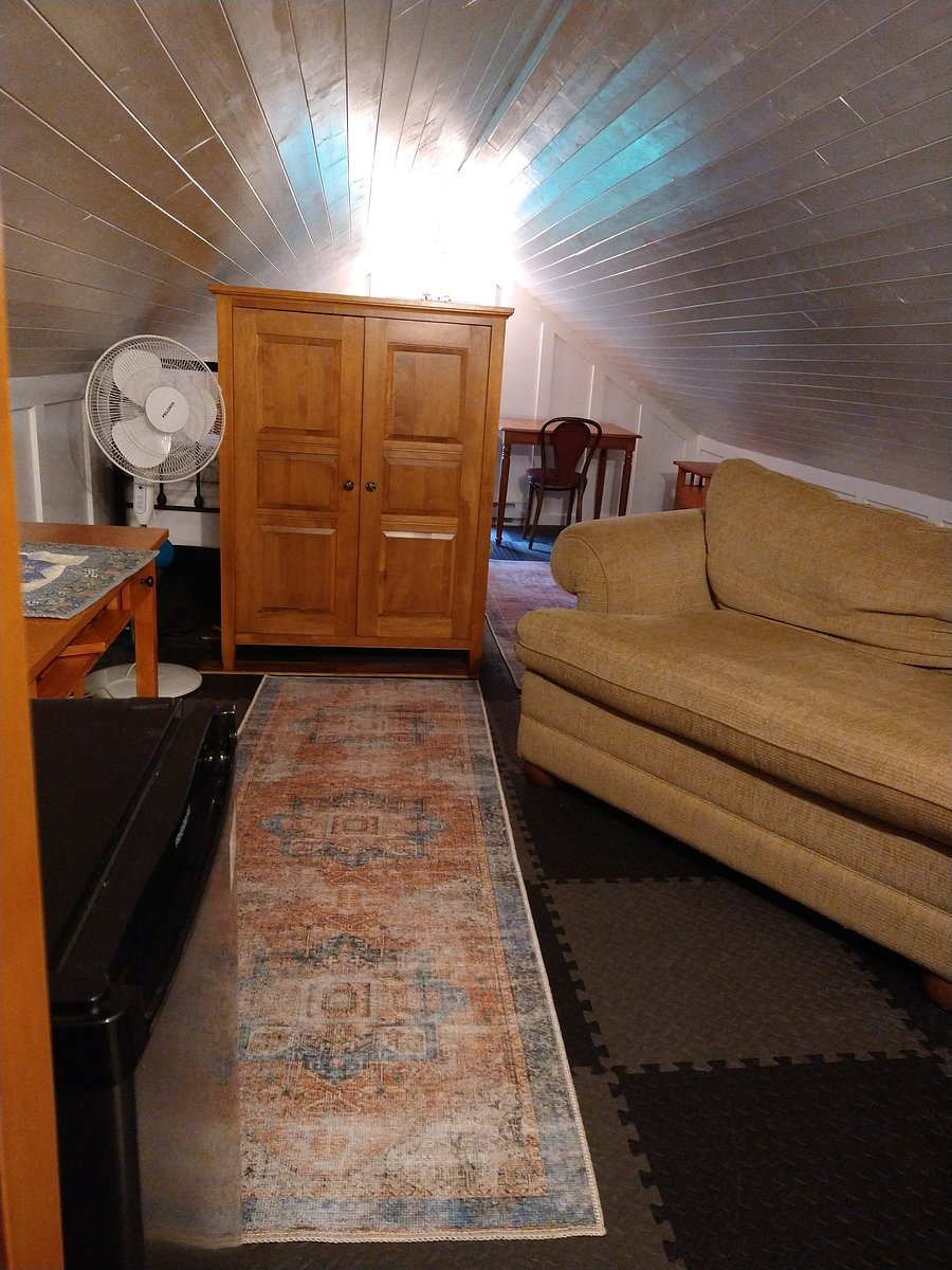 Unit 1:  second bedroom upstairs - converted attic which runs the length of the original house with windows on each end.  Queen Bed, single pull out couch, second single floor bed.