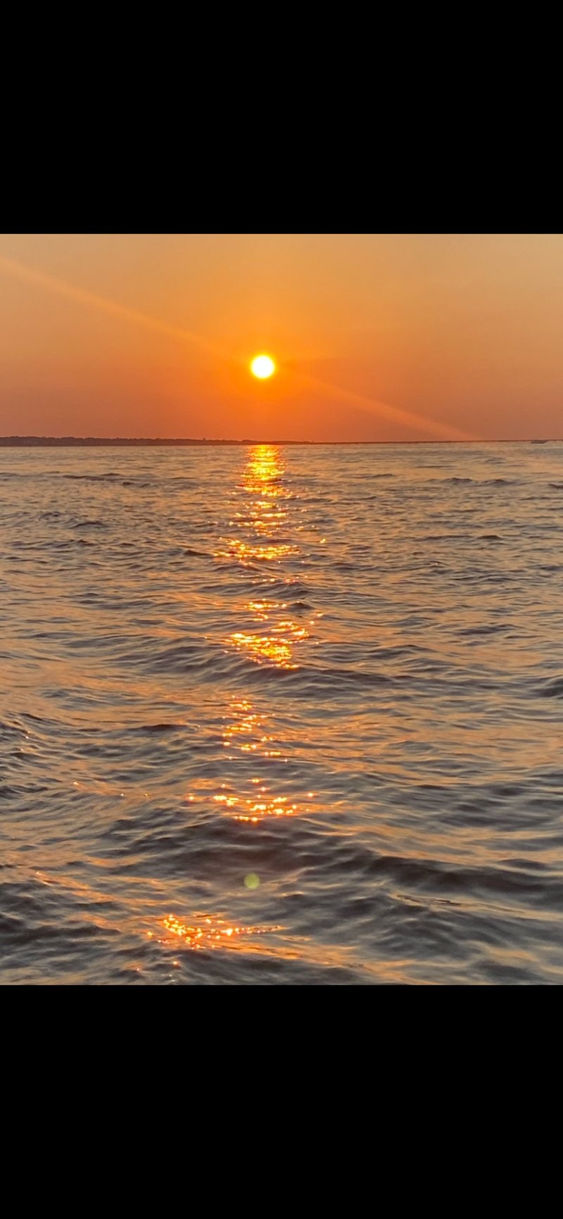 The Big Orange Ball heading towards the Chesapeake Bridge Tunnel one gorgeous summer evening!