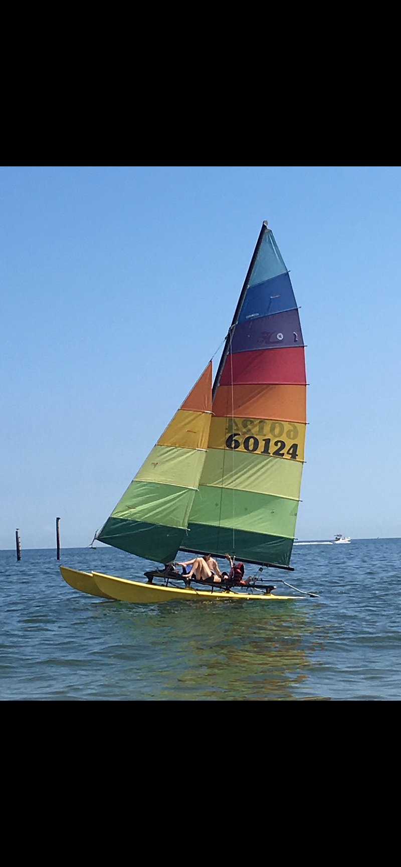 One of our catamaran buddies cruising by one gorgeous sunny Summer morning!
