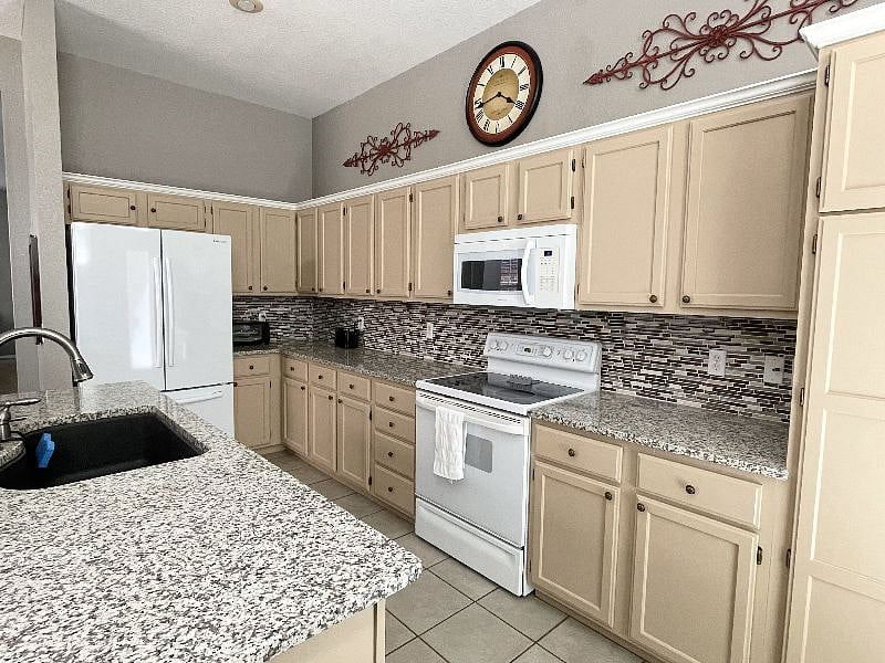 Fully equipped kitchen with countertop Keurig machine (not pictured), toaster oven, and toaster.