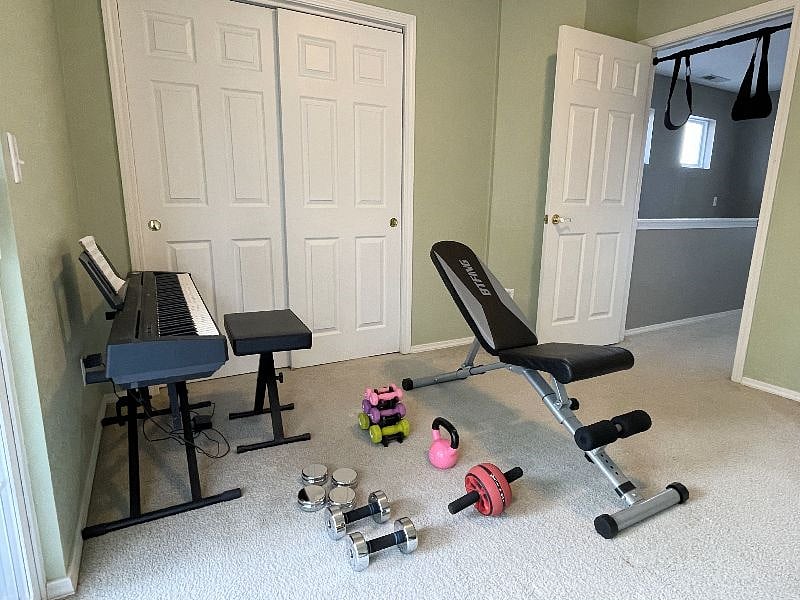 Third, unfinished bedroom currently used as multi purpose workout / piano room.