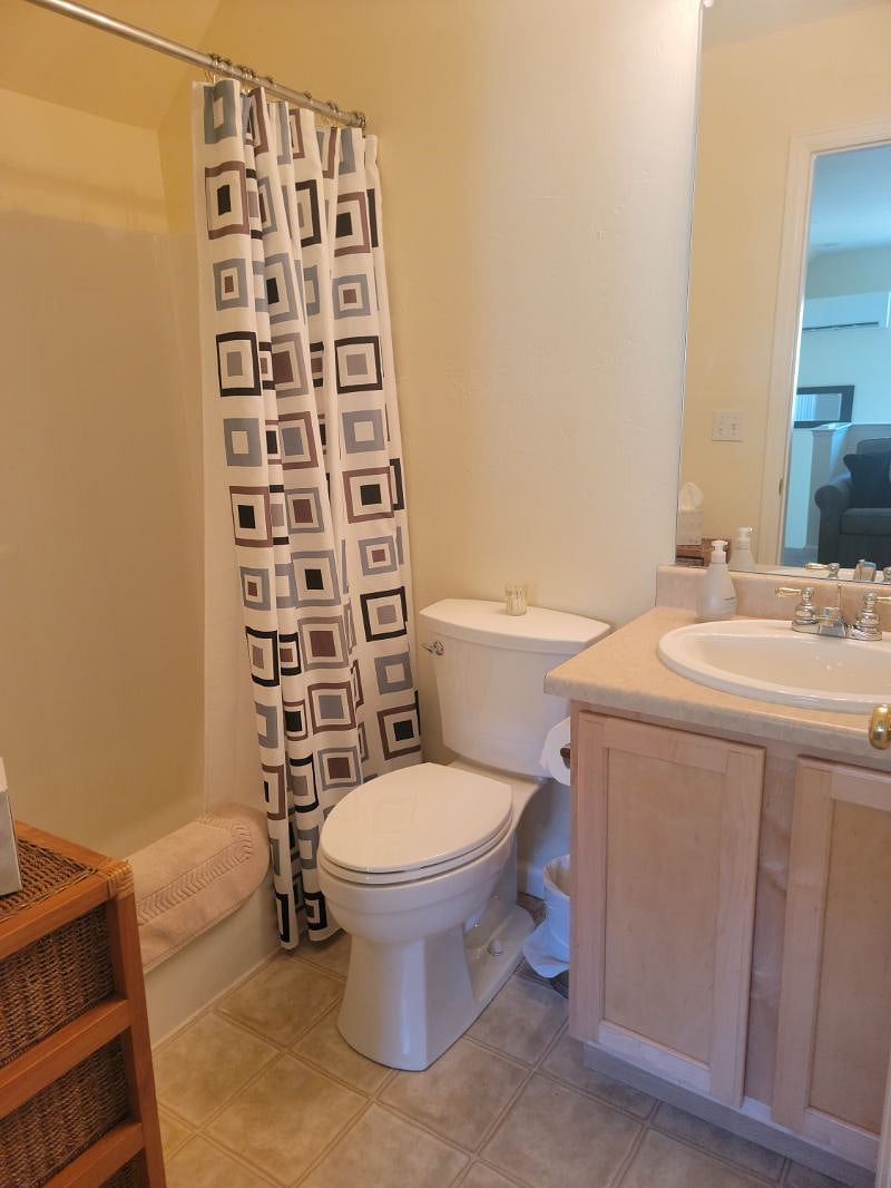 Bathroom has tub/shower, sink and new toilet