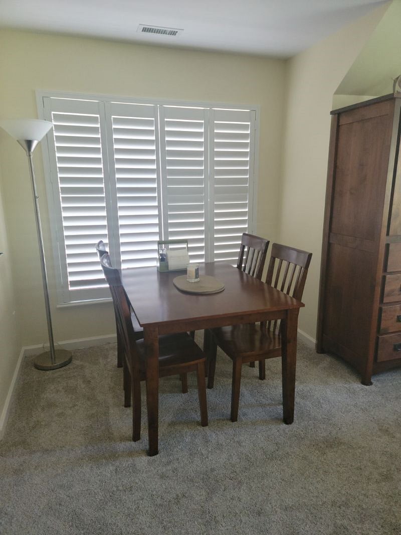 Dining table seats 4.  Shutters are able be fully or partially opened.