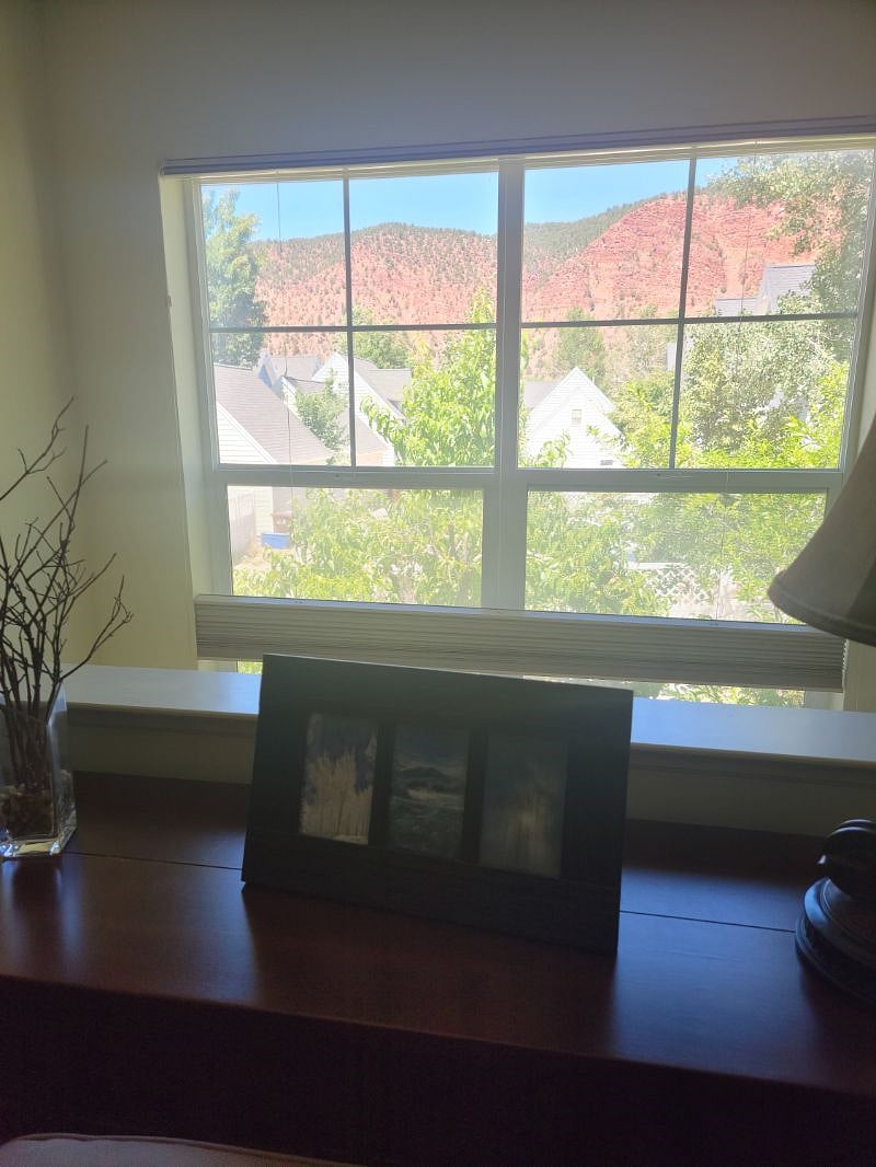 View of the red mountains.  This window features a black-out shade.