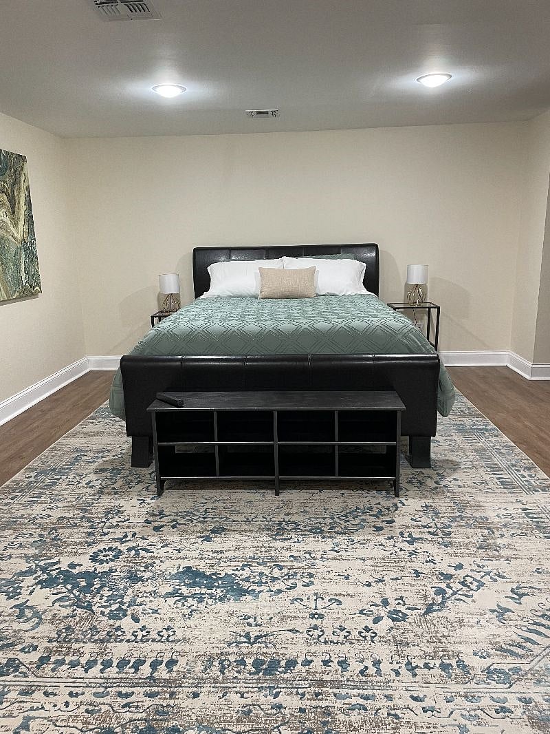 Shoe storage at foot of Queen Bed