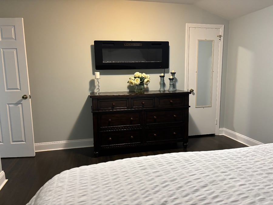 Main Bedroom with King Bed and Wall Faux Fireplace Heater