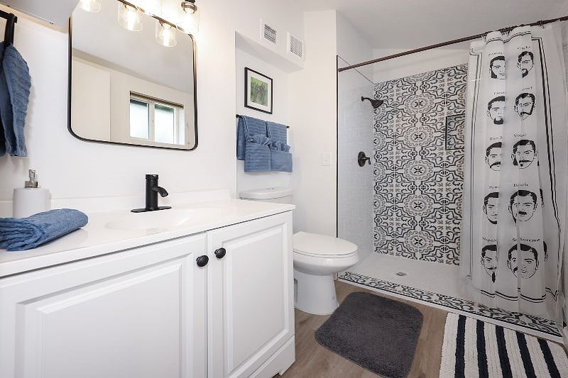 Master bedroom bathroom with new tile shower