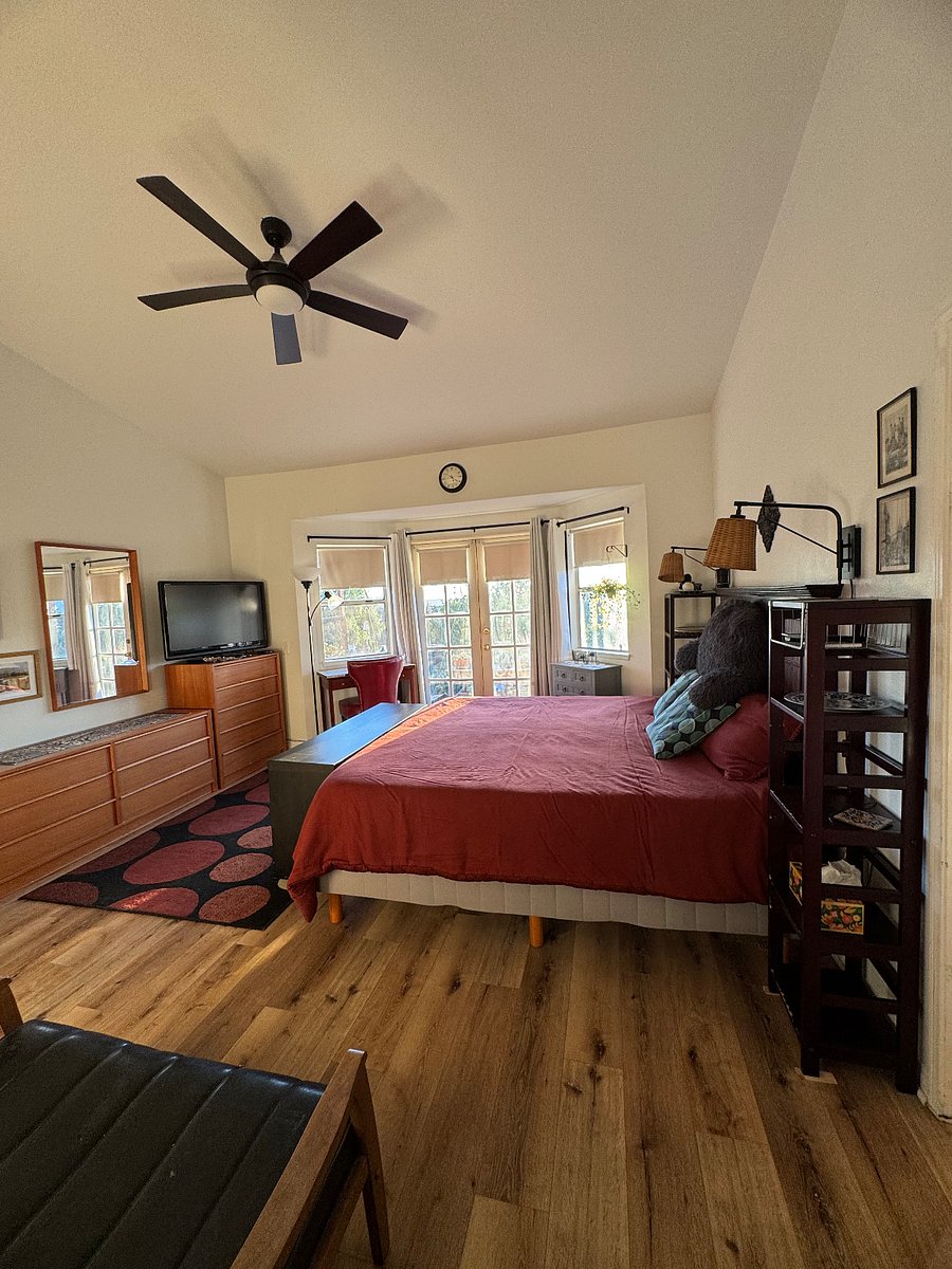 View of primary BR from door of large walk-in closet