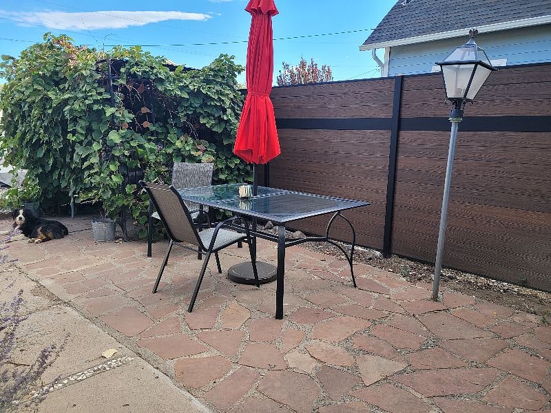 This is the patio looking towards the grape cove and the backyard. Fully fenced with privacy fences on both sides between the neighbors.